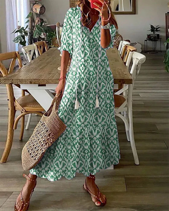 Printed long dress with V-neck and half sleeves